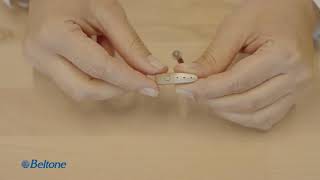 How to turn on/off the rechargeable hearing aid device through the push button